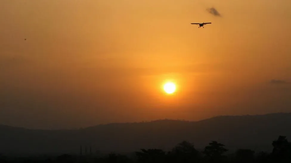 Patricia, pictured flying at sunset in Ghana, says she was told there was no place in the aviation industry for women