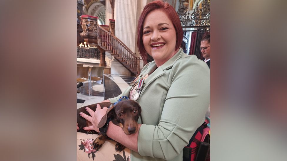 Martha Prinsloo and her service dog Daisy at St Paul's Cathedral