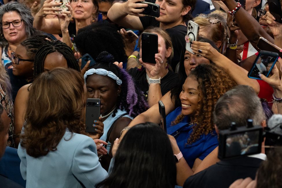 Harris being photographed by supporters