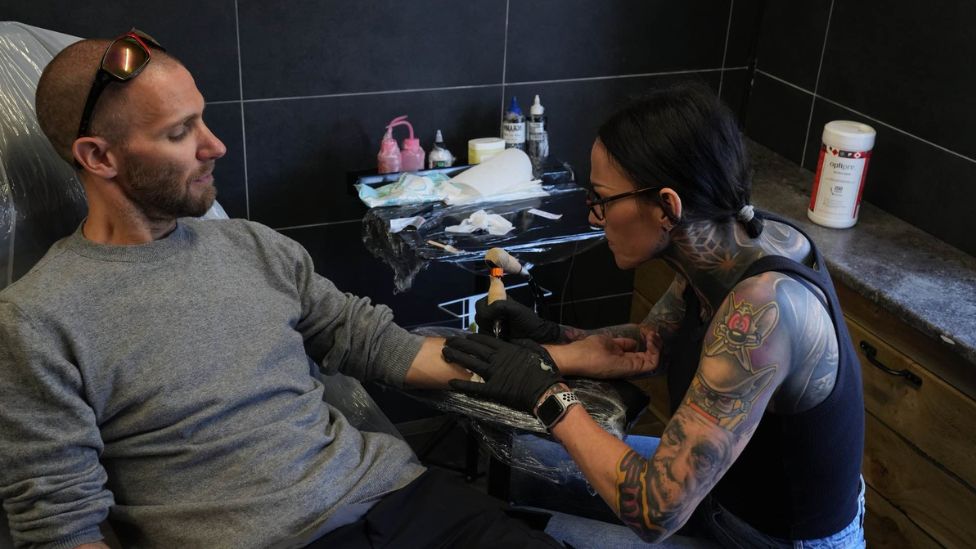 More Ipswich fans getting club tattoos to 'show love for team' - BBC News