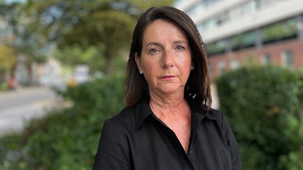 City of Lincoln Council chief executive Angela Andrews stood outside the council offices wearing a black shirt with shoulder length black hair