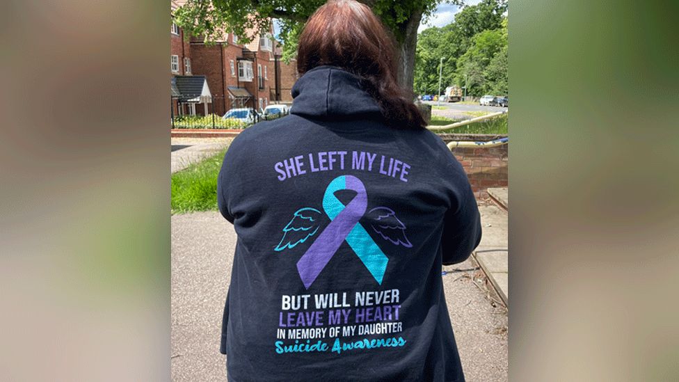 Back of woman wearing a hoodie