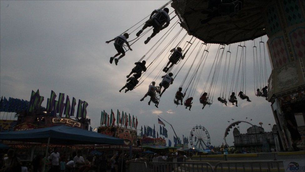 People on a fairground ride in Maryland, US.