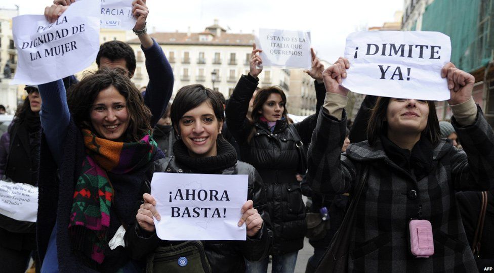 Protesters in Madrid hold signs saying 'enough' and supporting the dignity of women, Spain (13 Feb 2011)