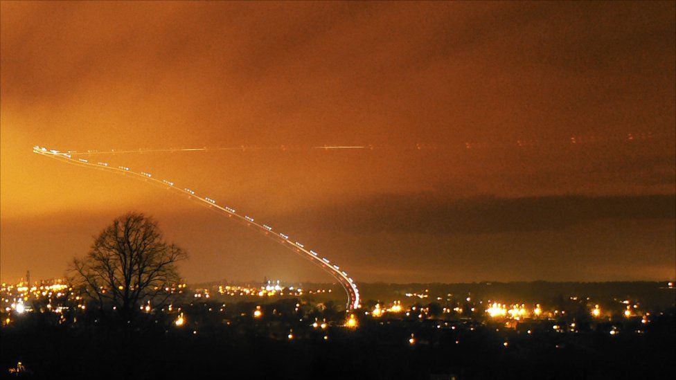 A night helicopter flight is captured by a 30 second exposure