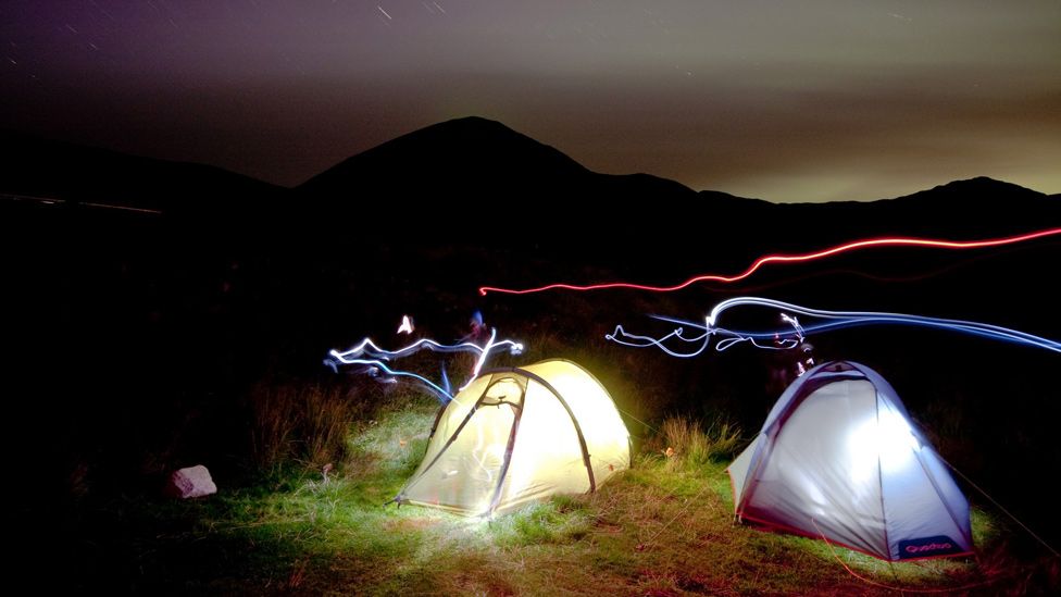 Tents lit up at night