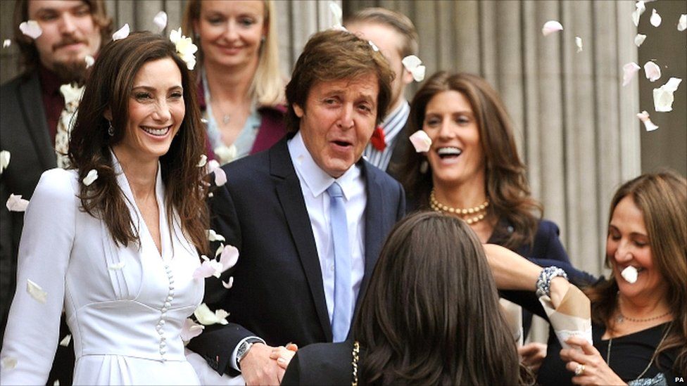 Sir Paul McCartney and Nancy Shevell emerge from the register office as man and wife