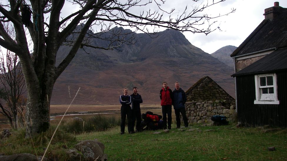 People standing outside a bothy