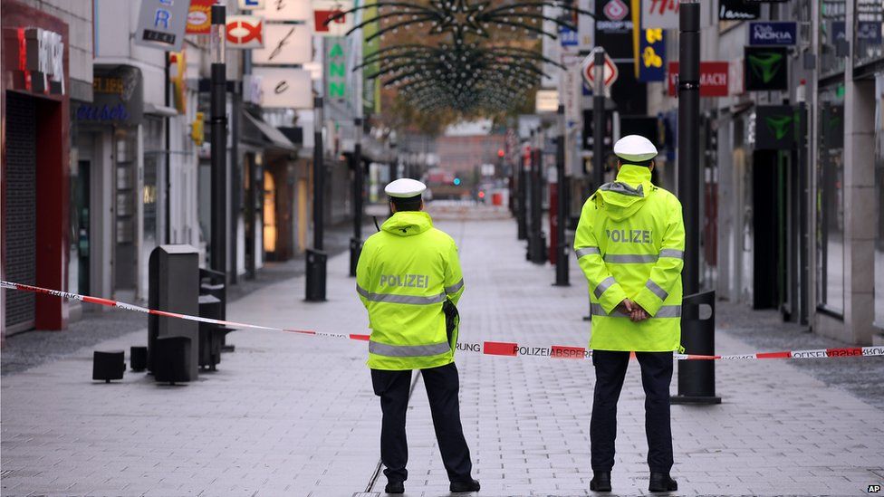 Police guard an empty shopping street in Koblenz, Germany, while a WWII bomb is defused on 4 December 2011