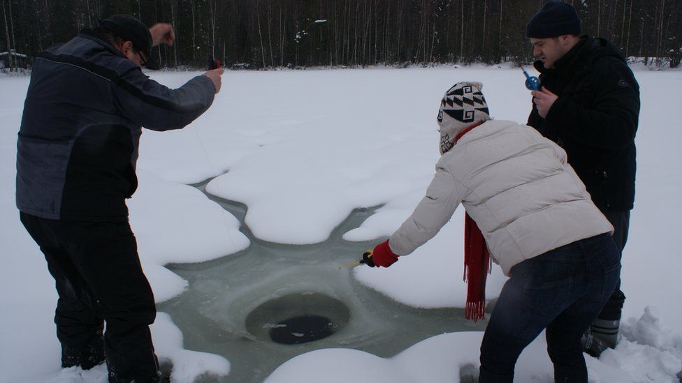 Ice fishing in Jyvaskyla, central Finland