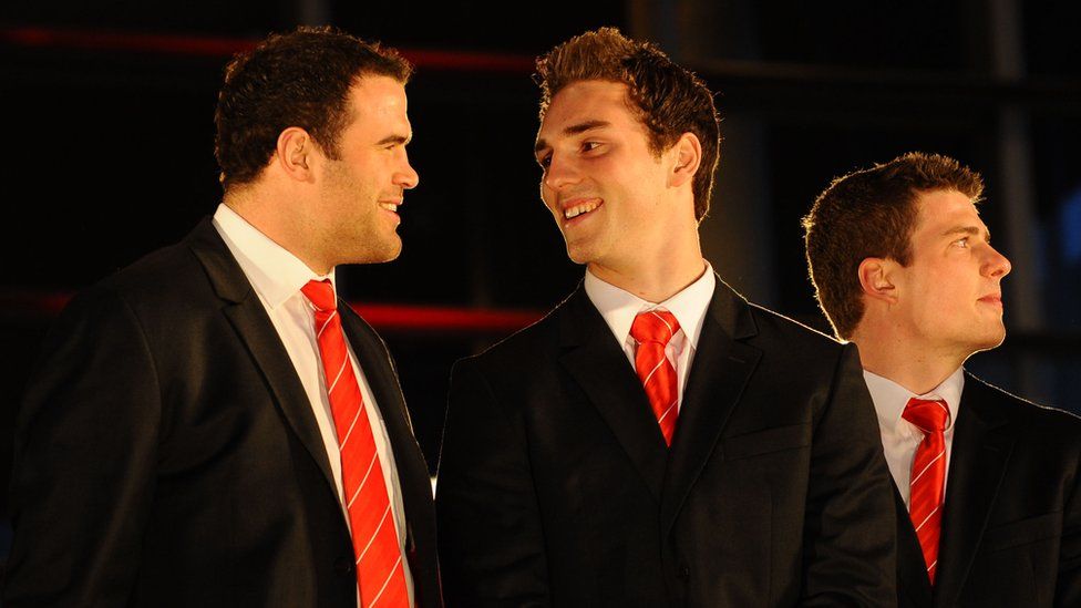 Wales centre Jamie Roberts and winger George North share a joke on the steps of the Senedd