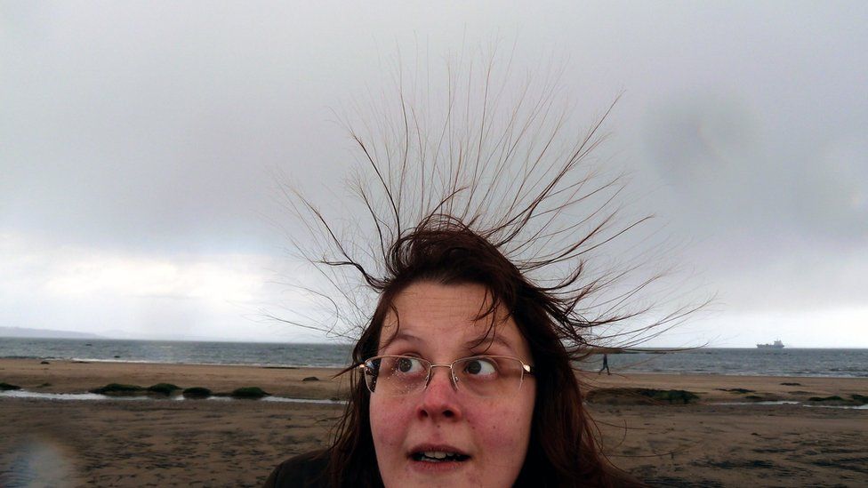 Susan and her static hair on the beach