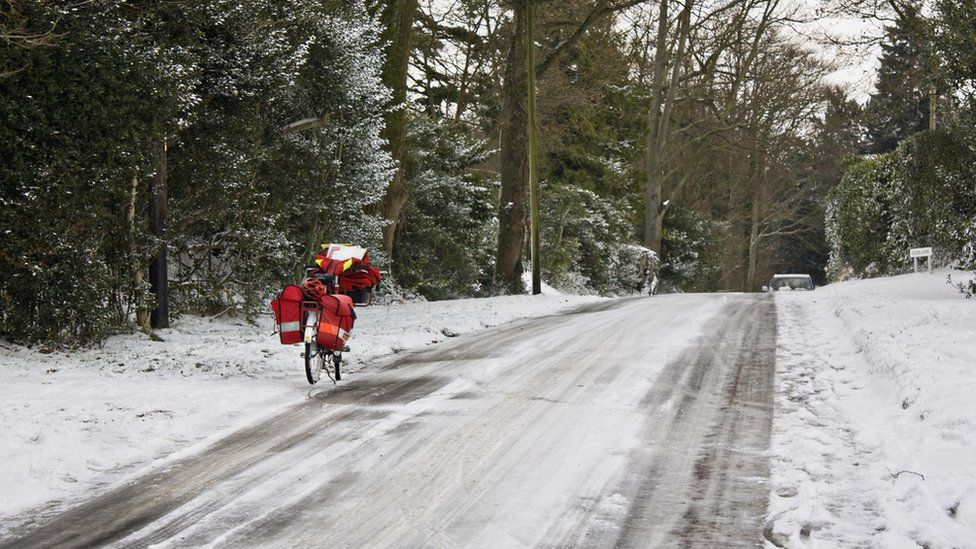 Royal Mail bicycle parked on an icy lane