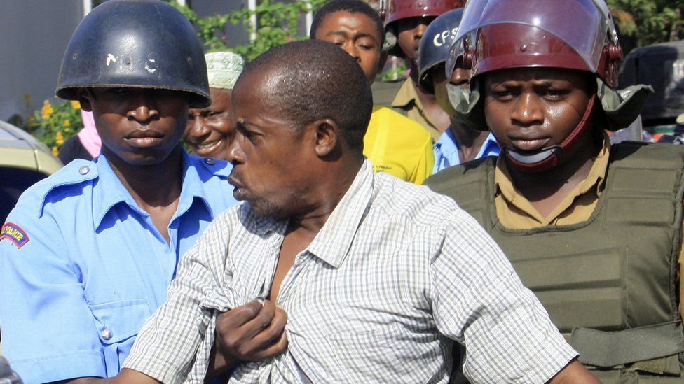 A sympathiser of the Mombasa Republican Council is arrested by riot-police on 24 April 2012 following violent confrontations in Kenya's coastal town of Mombasa
