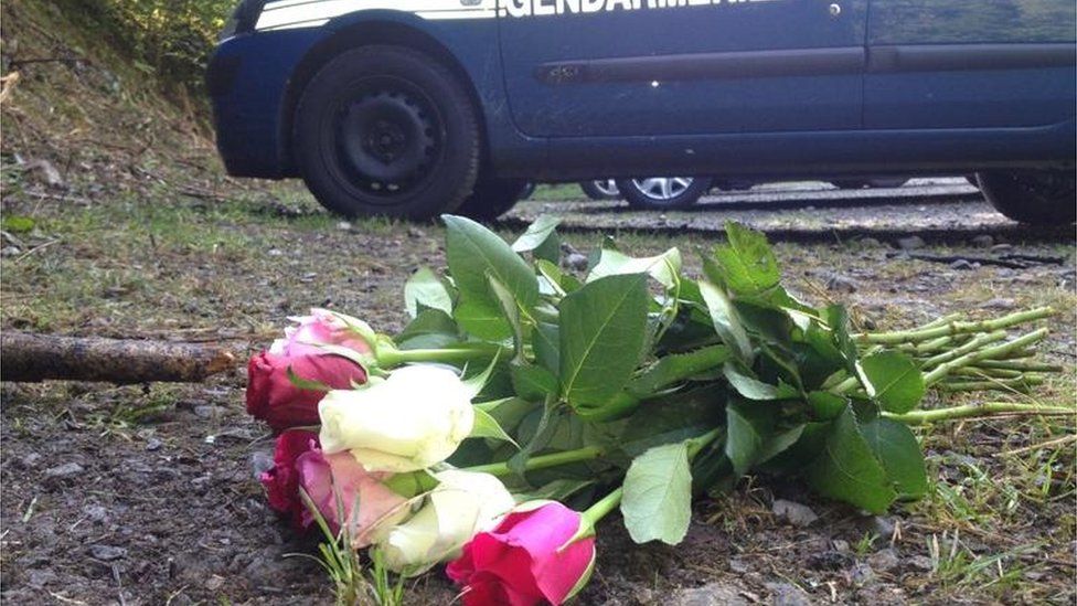 Flowers left at the scene of the shooting in Annecy, France