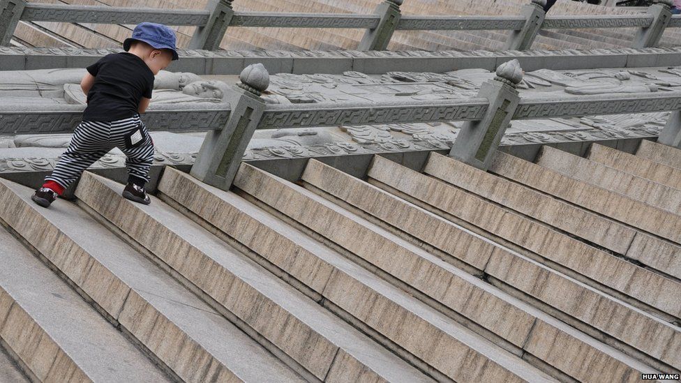 Boy climbing the stairs