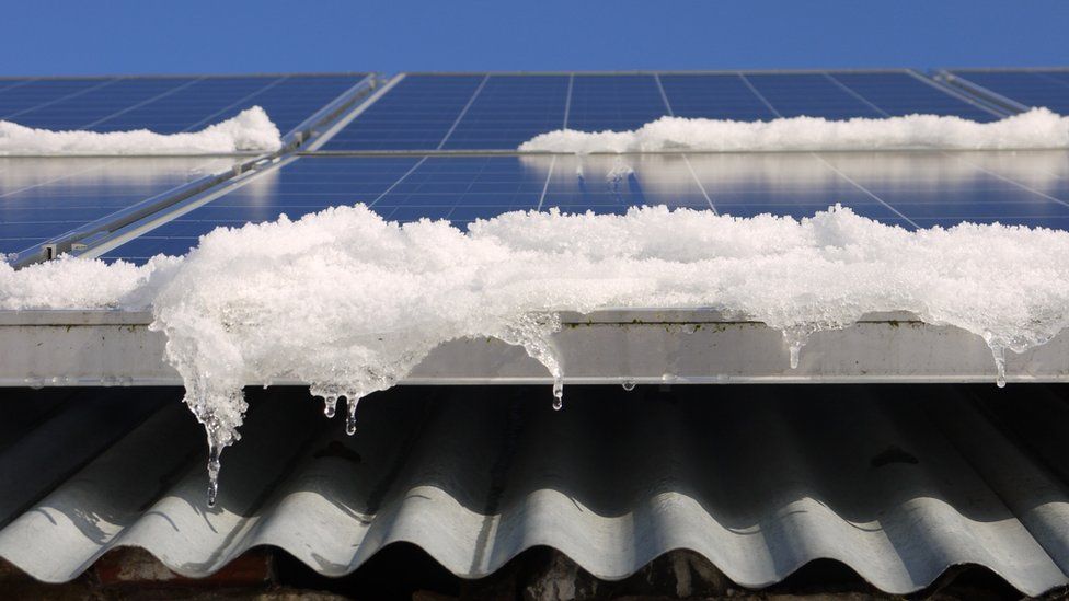 Snow melting off solar panels