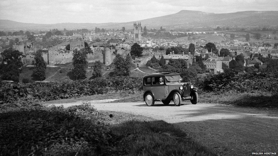 An Austin 7 negotiates a bend near Ludlow in Shropshire in the 1930s