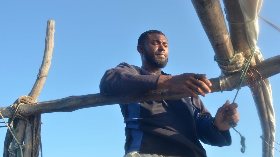 Abdillahi, the captain of the fishing vessel, tying ropes off the Kenyan coast