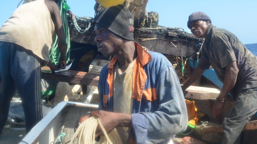 Crew members aboard the Kenyan fishing vessel prepare the longline
