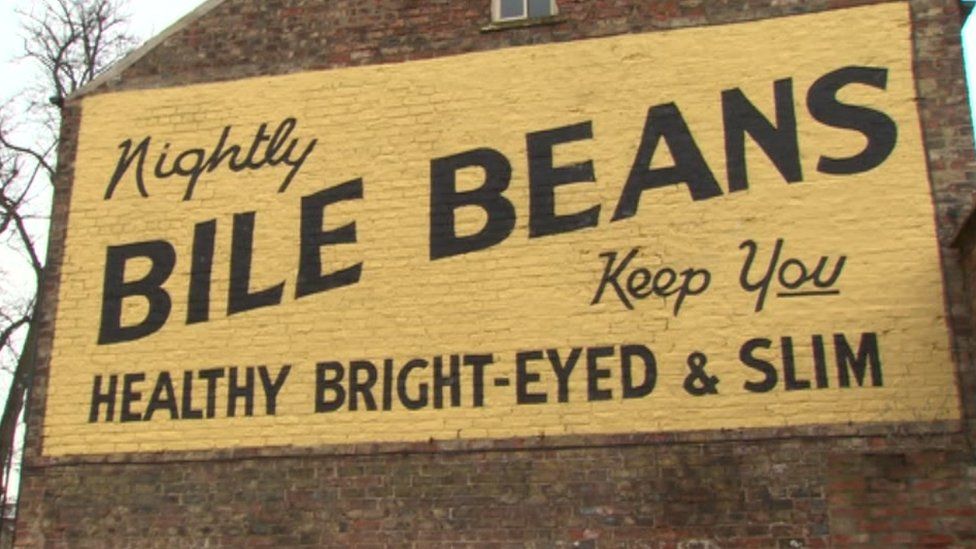 Advertising sign painted on wall