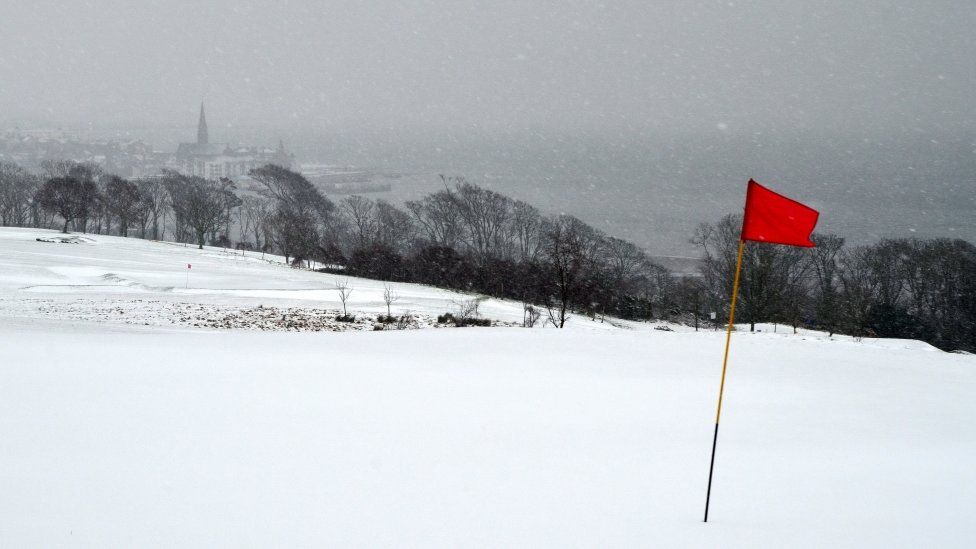Janet Parker took this at Routenburn Golf Course this morning. It was the red flag against the white snow with Largs in the background that made me get out of the car in the middle of a blizzard to take the photo!