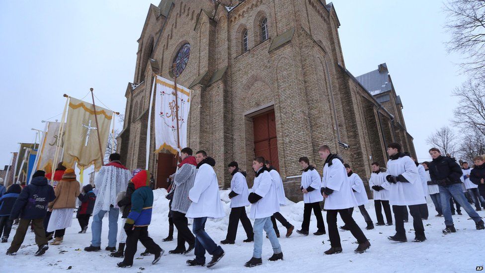 Catholic worshippers in Rakov, 45km (28 miles) north-west of the Belarusian capital, Minsk, take part in a Sunday procession.