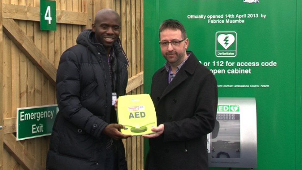 Fabrice Muamba and Mark Mapp with Guernsey's first public access defibrillator