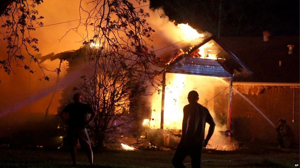 A firefighter tackles a blaze at a property near the fertiliser plant.