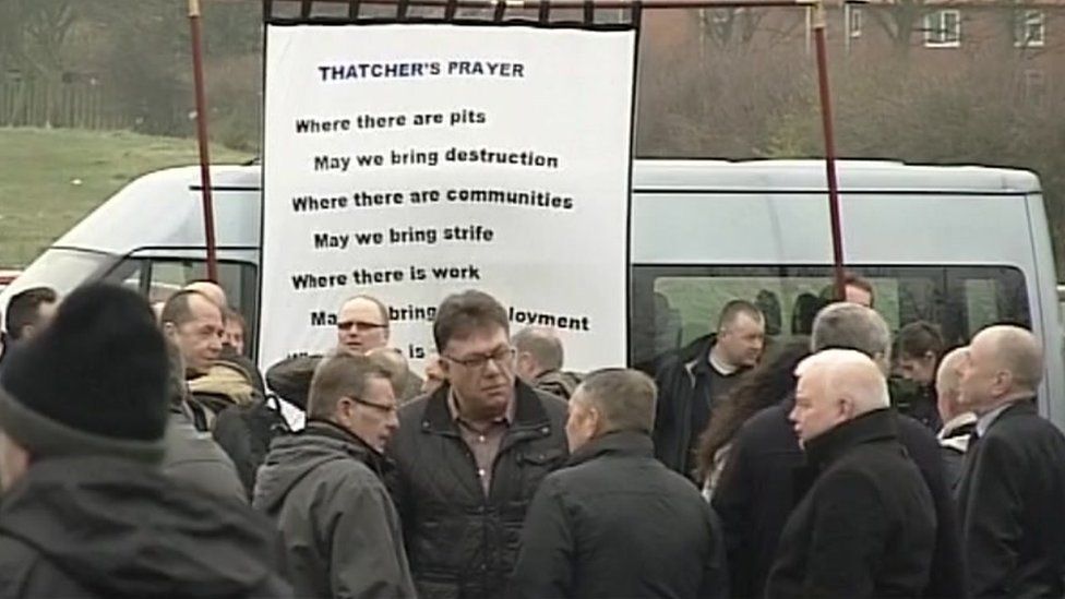 Banner entitled Thatcher's Prayer in crowd