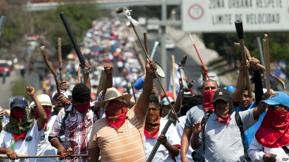 Teachers march on the main highway between Mexico City and Acapulco on 18 April 2013