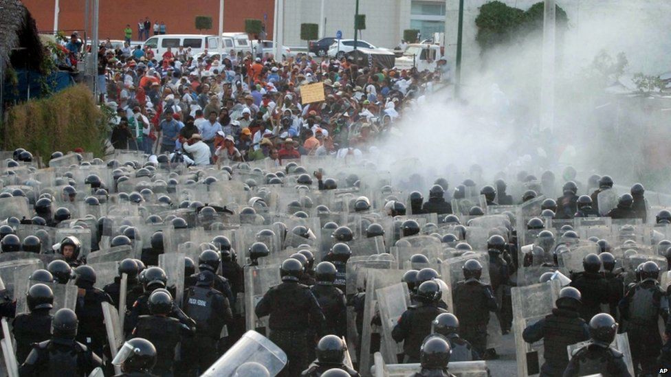 Federal police and teachers clash during a protest in April 2013