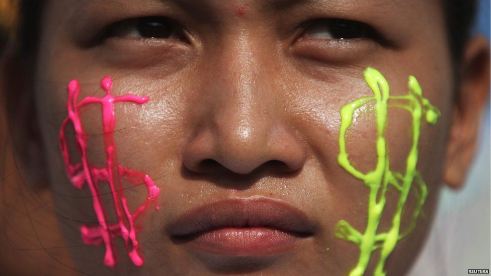 A garment worker attends a march on the streets to mark International Labour Day in Phnom Penh May 1, 2013.