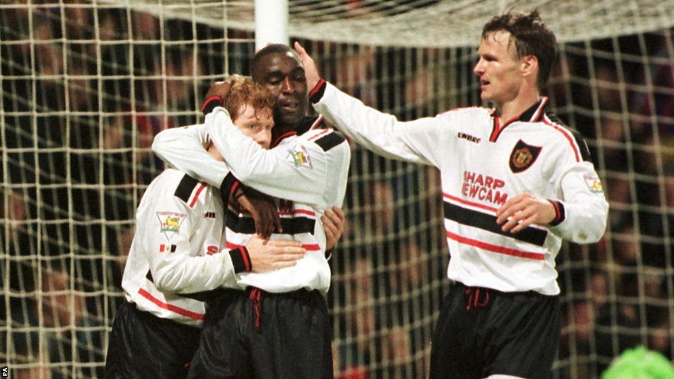 Manchester United's Paul Scholes (left) celebrates scoring a goal with Andy Cole and Teddy Sheringham (right)