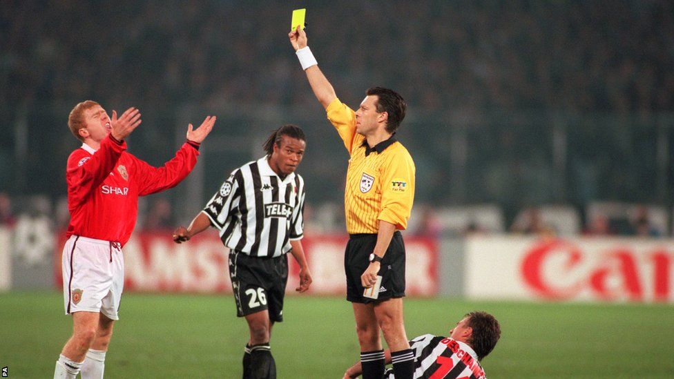 Manchester United's Paul Scholes is shown a yellow card against Juventus during the 1999 Champions League semi-finals