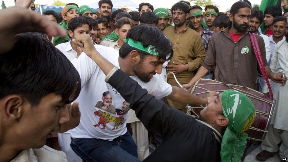 Supporters of Pakistan"s former Prime Minister Nawaz Sharif celebrate the victory of their leader in Islamabad, Pakistan