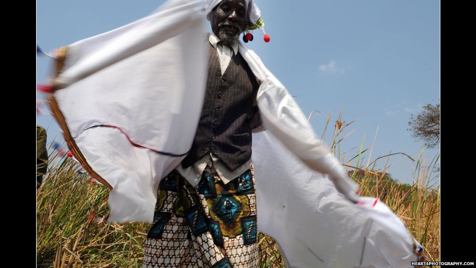Traditional healer in Tanzania in a three-piece suit