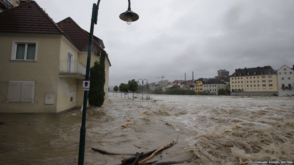 Flooded houses next to river Steyr are pictured during heavy rainfall in the small Austrian city of Steyr June 2, 2013