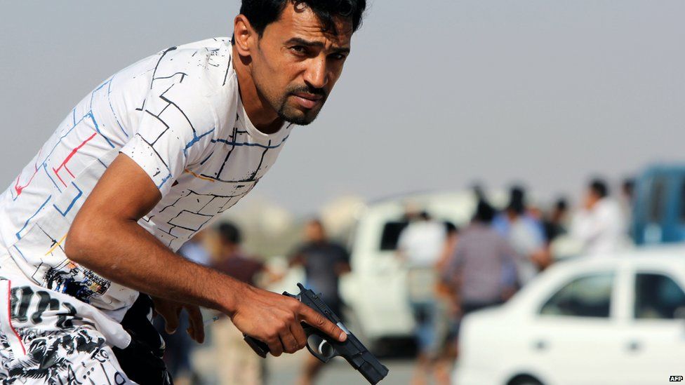 A Libyan protester in Benghazi holding a gun - Saturday 8 June 2013