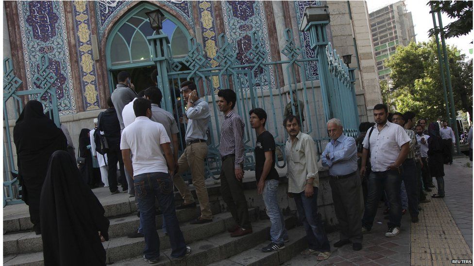 Iranians stand in line to vote at a mosque during the Iranian presidential election in Tehran June 14
