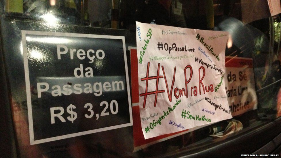 Placards stuck to a bus window in Sao Paulo, 17 June 2013