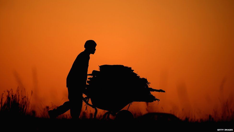 A man with a wheelbarrow in Diepsloot, South Africa - Monday 17 June 2013