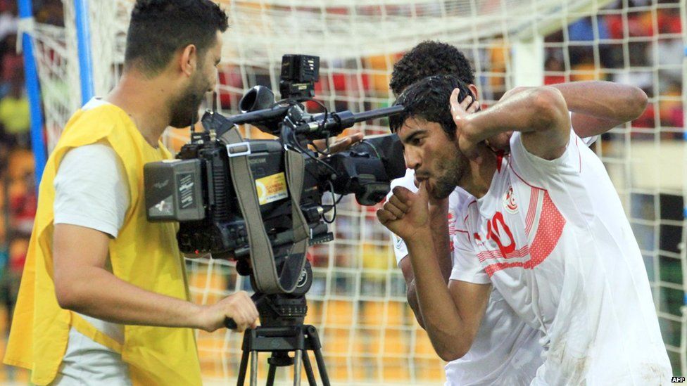Tunisian footballer Oussama Darragi pulling a face in front of a television camera after scoring in Malabo, Equatorial Guinea - Sunday 16 June 2013