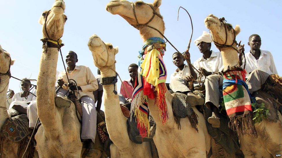 Men on camels in Darfur, Sudan - Tuesday 18 June 2013