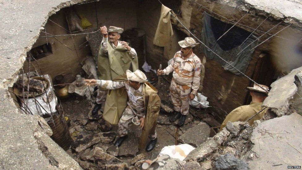Indo-Tibetan Border Police (ITBP) personnel search for flood victims in a damaged house in Uttarkashi, Uttarakhand