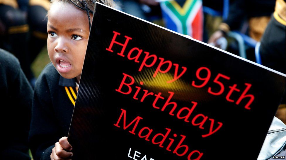 Children hold placards at a township school, Atteridgeville, near Pretoria (18 July)