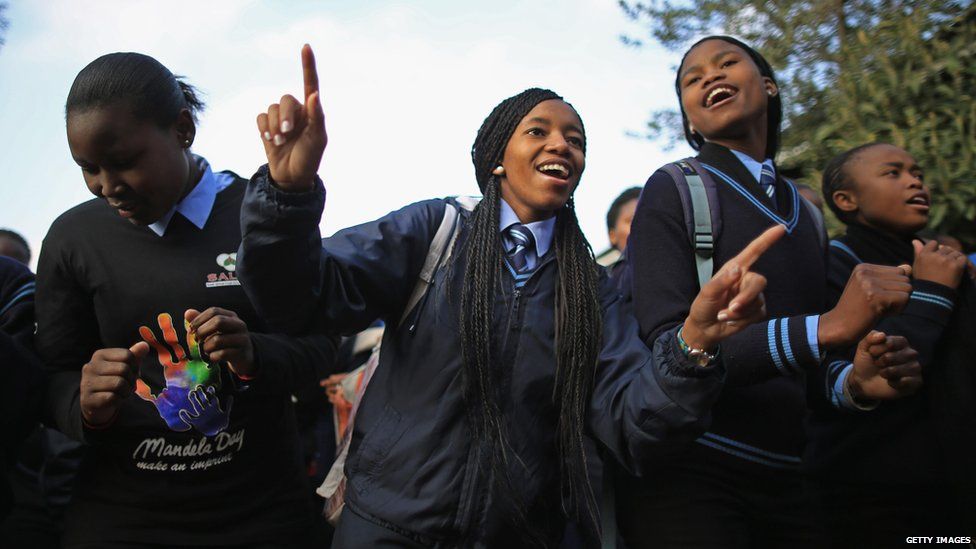 Pupils at Phefeni High School, Soweto, sing Happy Birthday to Nelson Mandela (18 July)