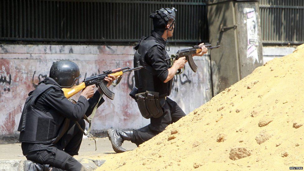 Riot police open fire at members of the Muslim Brotherhood and supporters of deposed Egyptian President Mohammed Morsi around Cairo University and Nahdet Misr Square, where they are camping in Giza, south of Cairo 14 August 2013