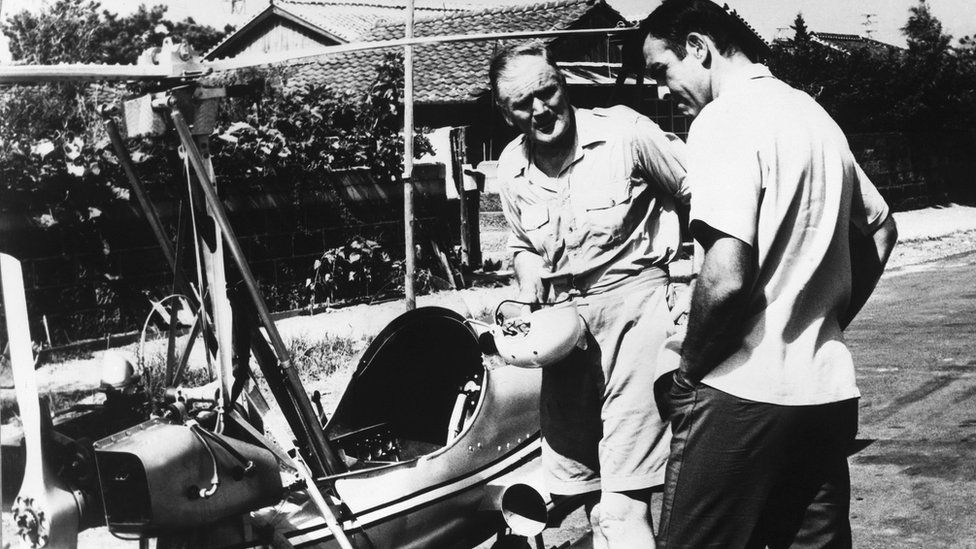Japan, Tokyo - Sean Connery as Bond and Desmond Llewelyn as Q in a scene from the James Bond movie You Only Live Twice, with the autogyro Little Nellie. 1967