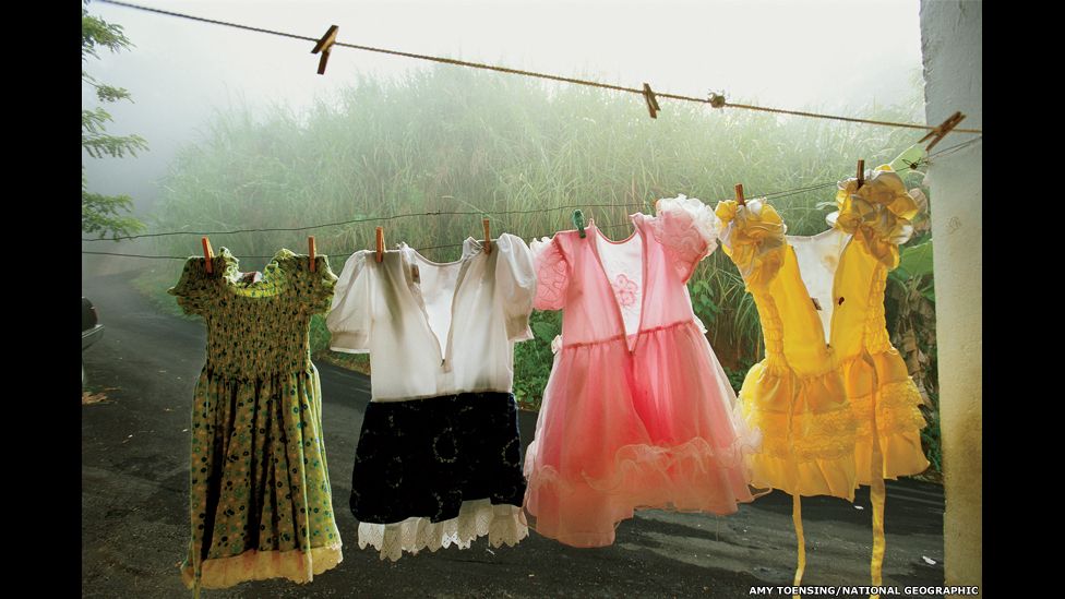 Dresses festoon a clothesline in Utuado, a lush mountainous region in central Puerto Rico.